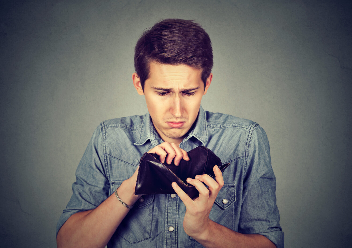 man with empty wallet bankrupt