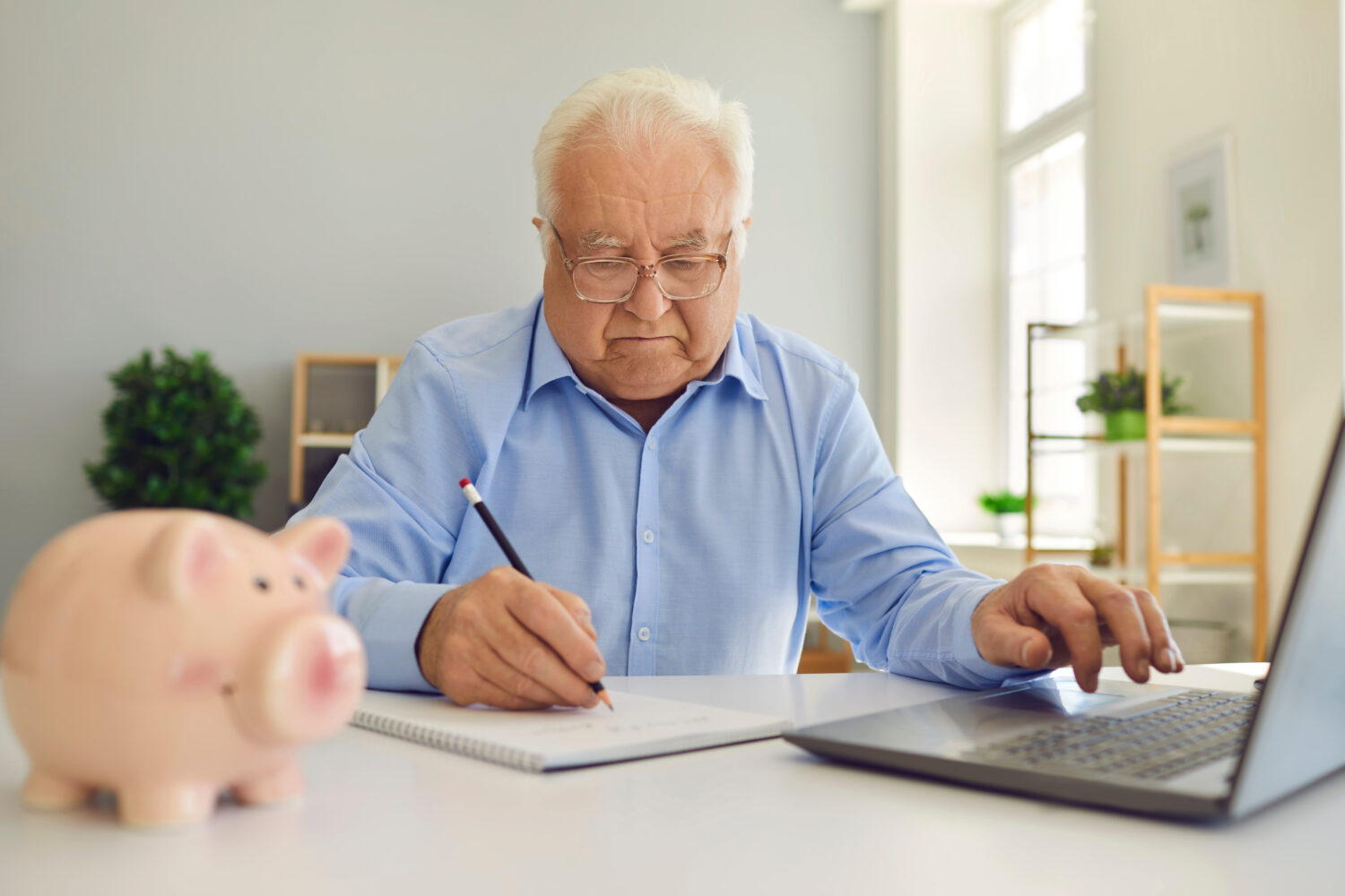 older adult with piggy bank